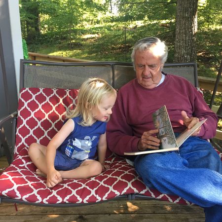 Dad reads to Henry.