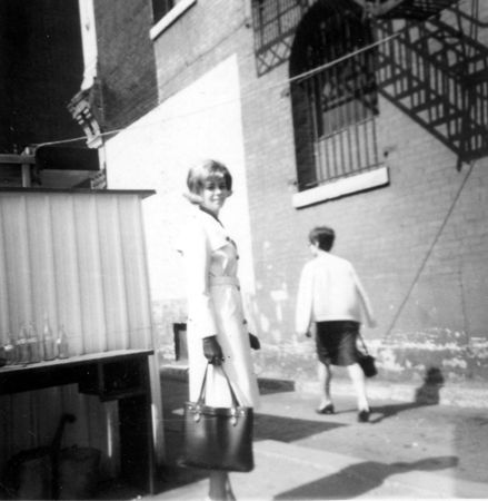 Mom says: “On my lunch break, downtown Cincinnati. Lucy and i going for a bite to eat or shopping. Dig the big bag, not a dooney. Oh, that hair dooooooo wish I were that skinny now - looked good.”
