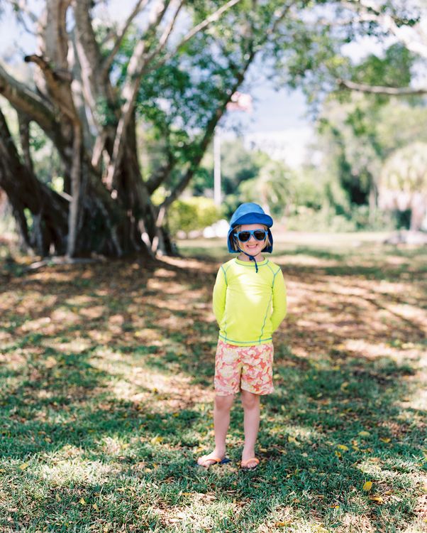 Henry by the banyan trees in the neighborhood.